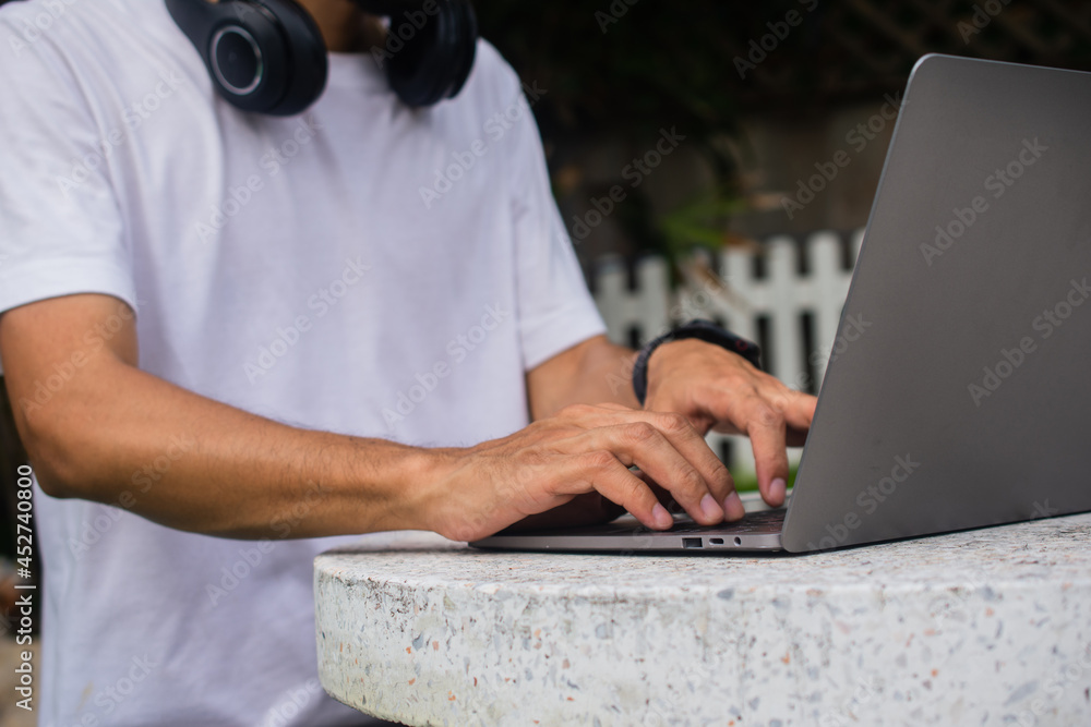 Poster man using computer online working at home