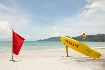Close up view of rescue surf board on tropic beach background