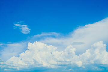 Naklejka na ściany i meble huge White fluffy cloud against blue sky summer background