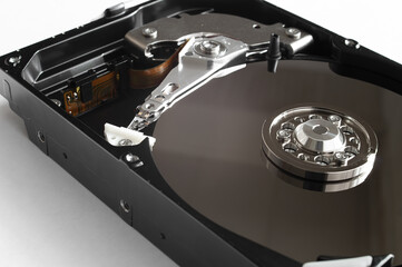 Disassembled computer hard drive. Storage device inside. 