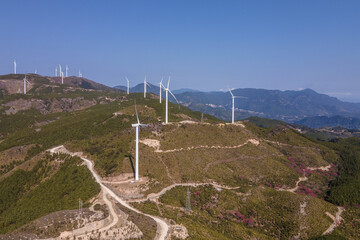 Aerial photography of the wind turbine on the mountain