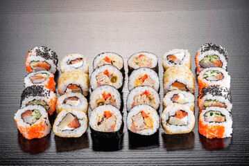 Sushi set isolated on black background. Photo for the menu and site. Top view. High quality photo