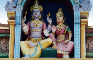 view of Indian Hindu God Rama and Sita statue on the temple tower or gopuram