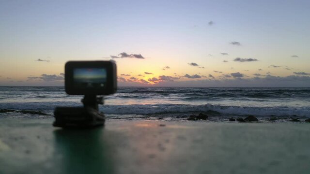 Aerial: Lockdown Shot Of Camera Filming Beautiful View Of Sea Against Sky During Sunset - Cozumel, Mexico