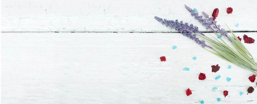 Spa theme with candles and flowers on wooden background