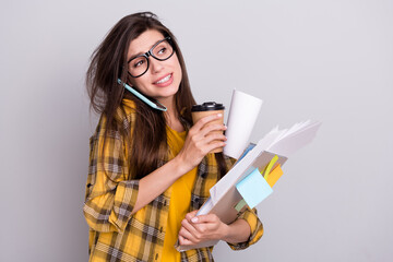 Photo of young woman speak listen cellphone busy job project documents drink coffee isolated over...