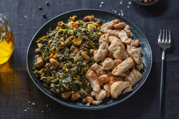 Green kale salad with chicken on plate