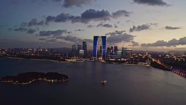 CBD buildings by Jinji Lake at night in Suzhou, China.