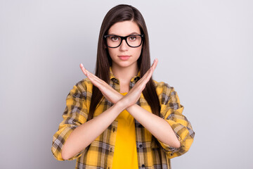 Photo of young girl unhappy moody crossed hands denial refuse block signal isolated over grey color...