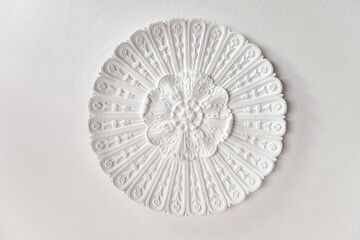 Decorative element of design stucco molding on the ceiling