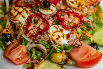 Mediterranean salad with vegetables, eggs, seasoned with soy sauce