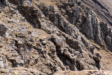 Stony rock wall, texture of stones, background wallpaper 