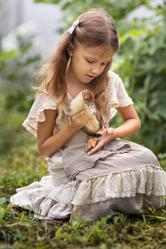 Girl with ducklings