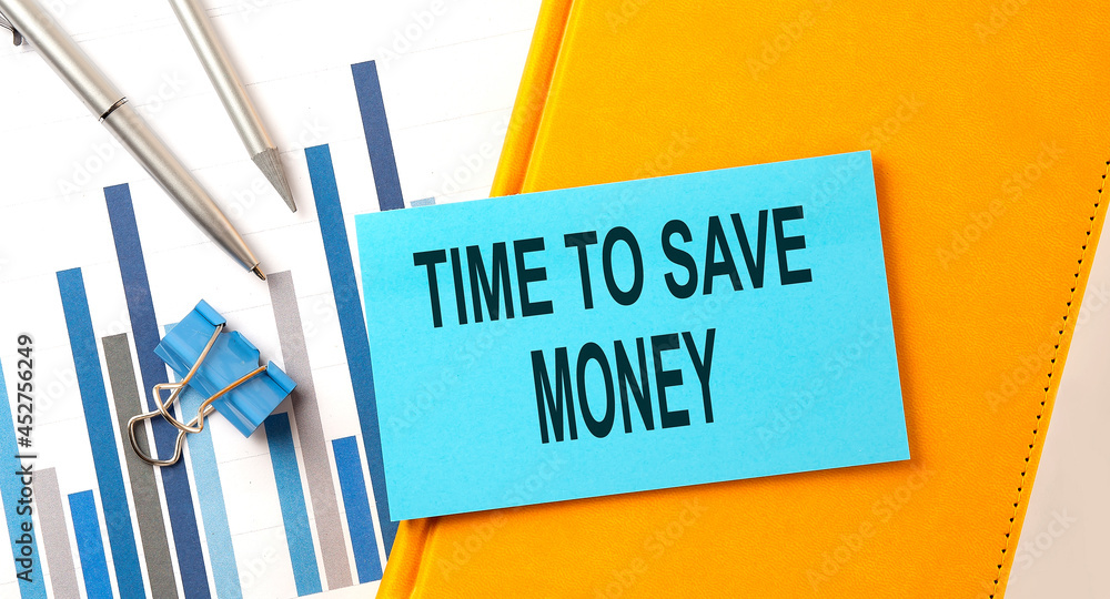 Poster time to save money text on sticker on the yellow notebook with chart and pen