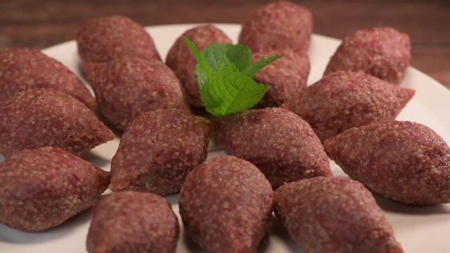 Traditional kebbe on turntable in lebanese restaurant, High quality 4k footage