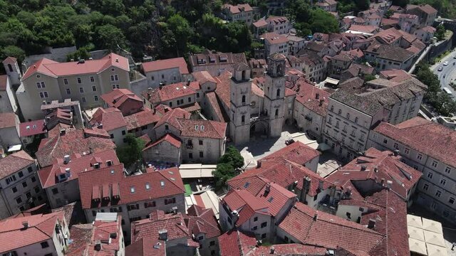 Kotor Old Town, Montenegro. Drone Aerial View of Cathedral of Saint Tryphon and Old Stone Buildings in Fort on Sunny Summer Day