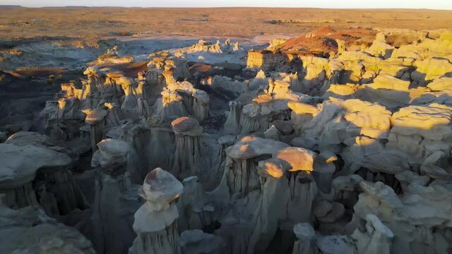Cinematic aerial shot of Valley of Dreams in Bisti De Na Zin Wilderness in New Mexico