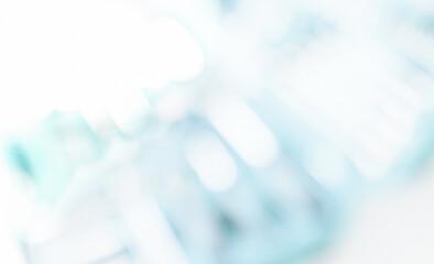 Blurred empty office, modern space with defocus windows. Abstract business building background with highlights and reflections.