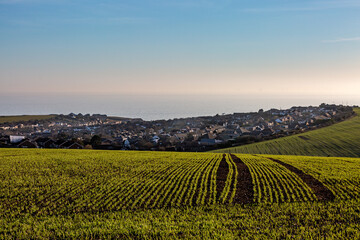 A View Out to Sea on the Sussex Coast, with Telescombe Village Behind Farmland