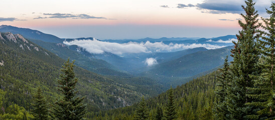 Mountain panorama over the clouds sunset along  Squa Pass Road near Echo Lake Park, Colorado