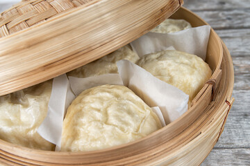 Vietnamese Chinesse steamed buns in a bamboo basket