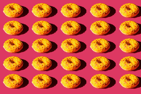 Top view of a donuts on pink background