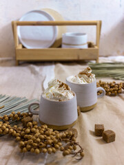 Cappuccino coffee with a white ceramic cup on a light background