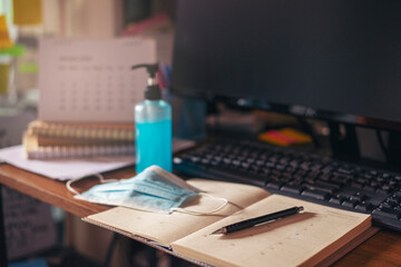 New Normal with Coronavirus Virus Protection concept.Alcohol gel and hygiene mask To quarantine from covid-19.Calendar Book for planner to plan event reminder, daily appointment and management a job