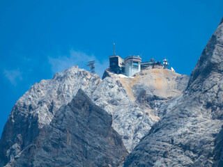 Panoramic view to the Zugspitze, Germany's highest mountain, with a weather station, environmental...