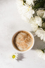 Fototapeta na wymiar coffee in a mug with milk and cinnamon
