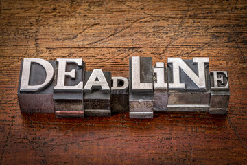 deadline word in mixed vintage metal type printing blocks over grunge wood, business and planning concept