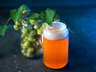 glass of craft beer on a dark table with a blue backlight. New England IPA