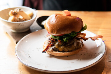 Cheeseburger with beautiful bacon strips.
