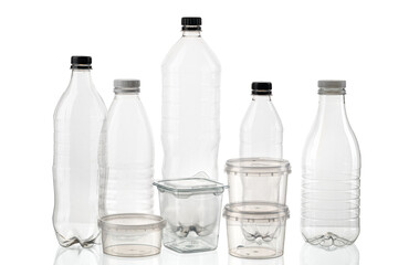 Silhouette of different types and sizes of empty transparent plastic bottles on white isolated background
