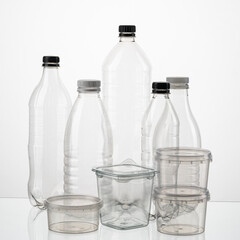 Silhouette of different types and sizes of empty transparent plastic bottles on white isolated background