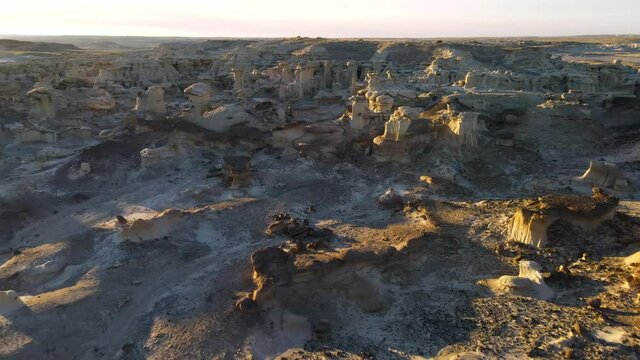 Cinematic aerial shot of Valley of Dreams in Bisti De Na Zin Wilderness in New Mexico
