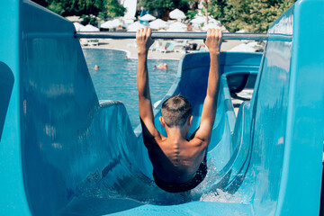 Teen boy at water slides