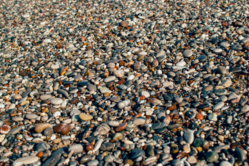 wet pebbles on sea shore background