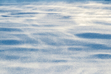 The surface of the snow after a blizzard in the morning with a strong wind