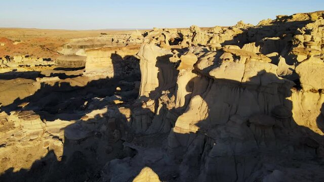 Cinematic aerial shot of Valley of Dreams in Bisti De Na Zin Wilderness in New Mexico