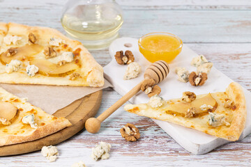 slice of pizza and blue cheese, caramelized pear and honey