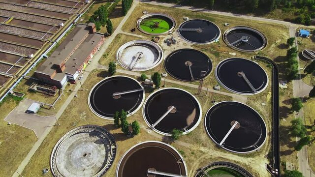 Round wastewater cleaning reservoirs at a sewage treatment facility. Grey water recycling, aerial view