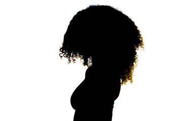Silhouette brunette girl with long curly hair. Studio portrait on white background.