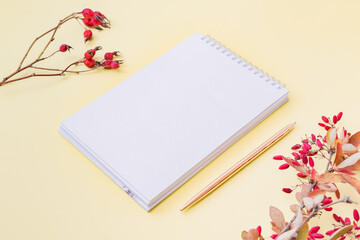 Mockup open white notepad on yellow background