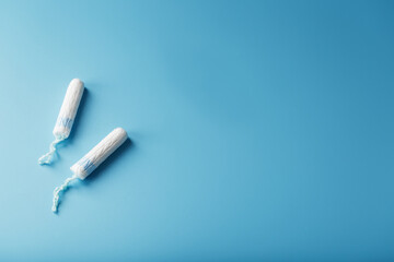 Gynecological tampons on a blue background free space