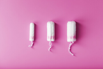 Gynecological tampons on a pink background free space