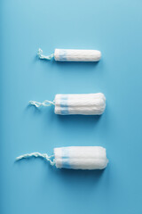 Gynecological tampons on a blue background free space