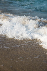 Sea or ocean tropical landscape view. Sea waves under the sun. Summer vacation and travel concept. Water wave surface. Sand beach. 