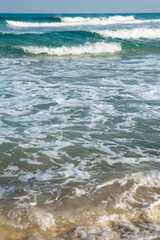 Sea or ocean tropical landscape view. Sea waves under the sun. Summer vacation and travel concept. Water wave surface. Sand beach. 