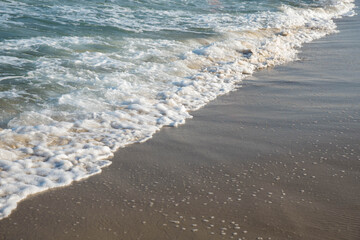 Sea or ocean tropical landscape view. Sea waves under the sun. Summer vacation and travel concept. Water wave surface. Sand beach. 